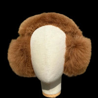 A brown fur earmuff displayed on a cream fabric mannequin head.