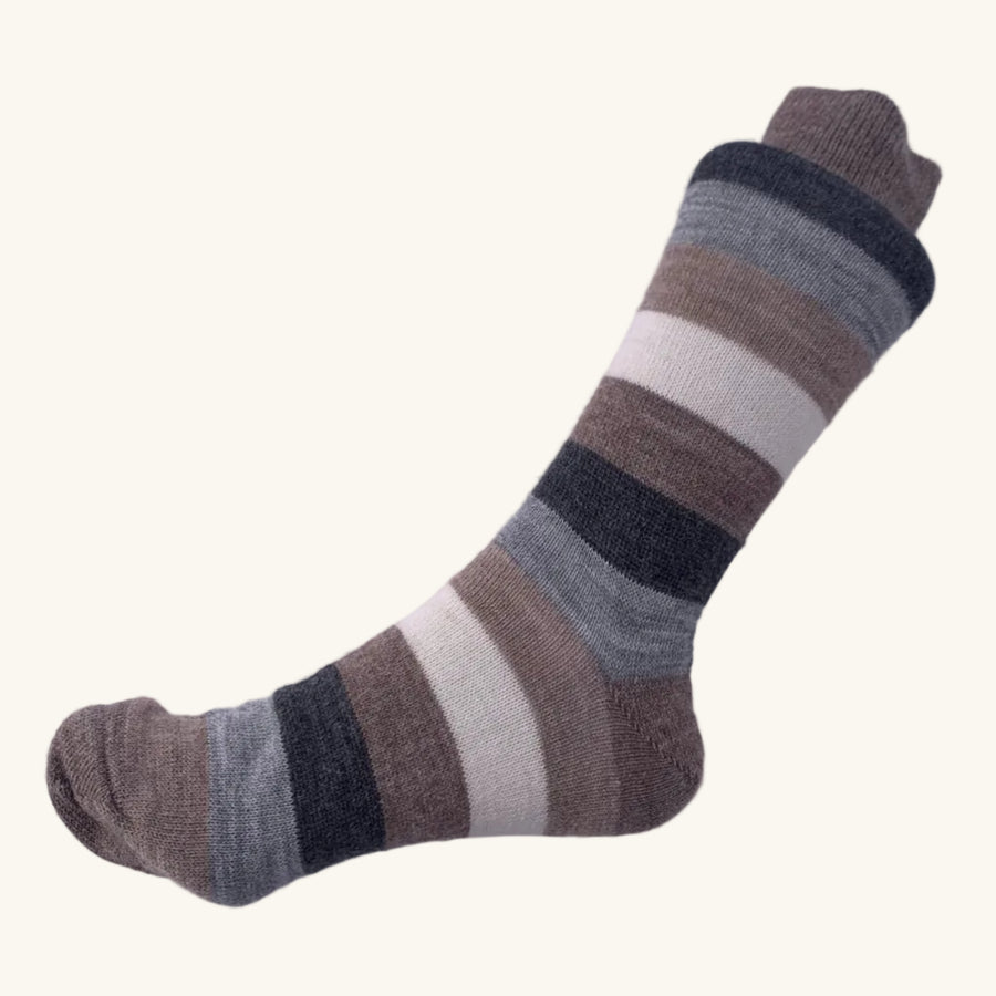 Striped sock on a white fabric background