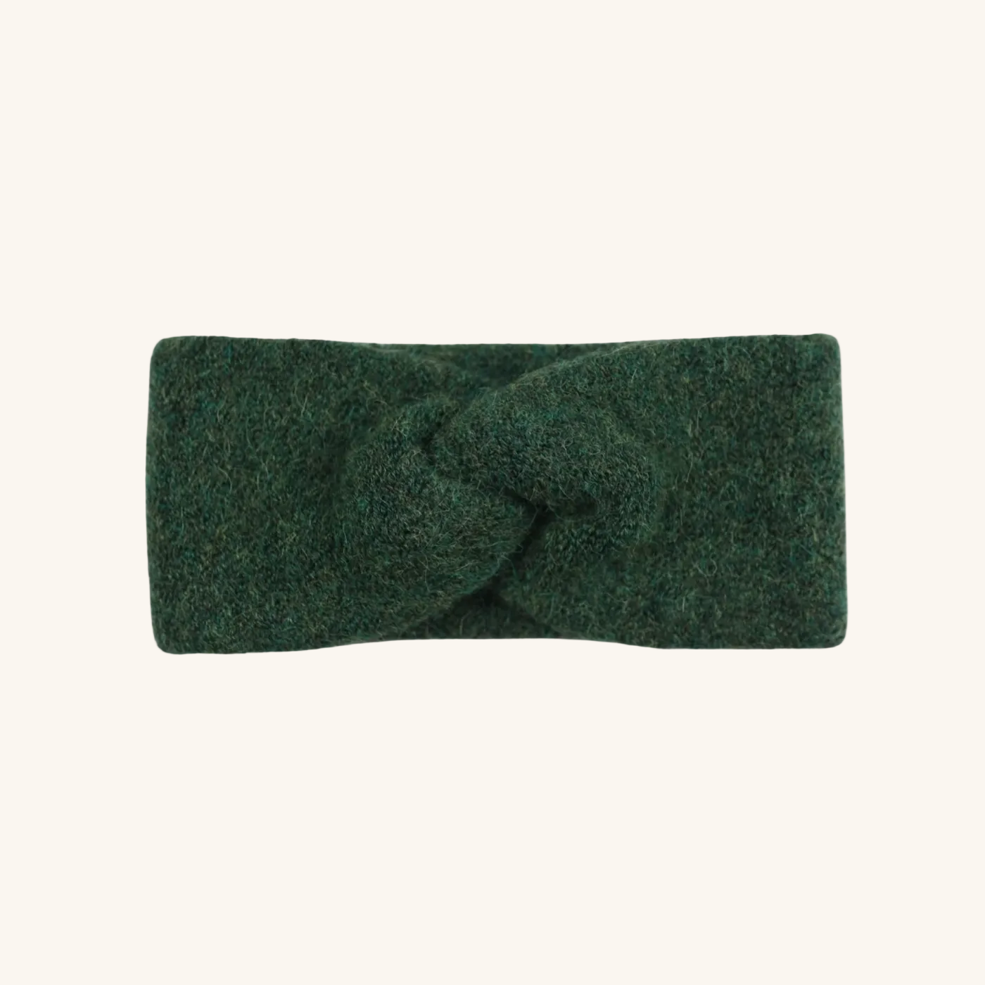 Green headband with a knot on a white background