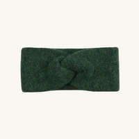 Green headband with a knot on a white background