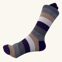 Striped sock on a white fabric background