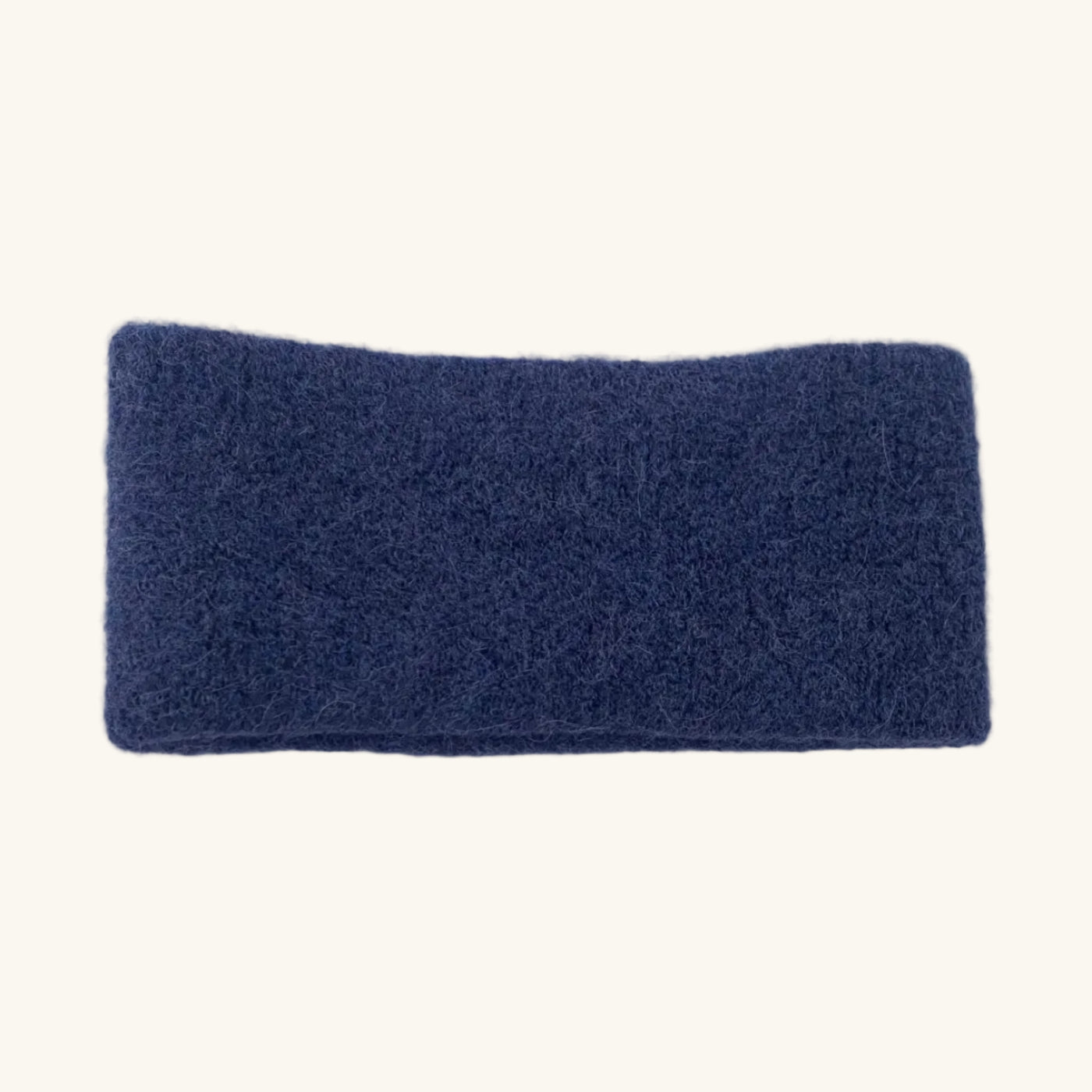 Blue headband on a white surface