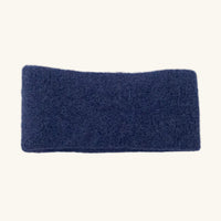 Blue headband on a white surface