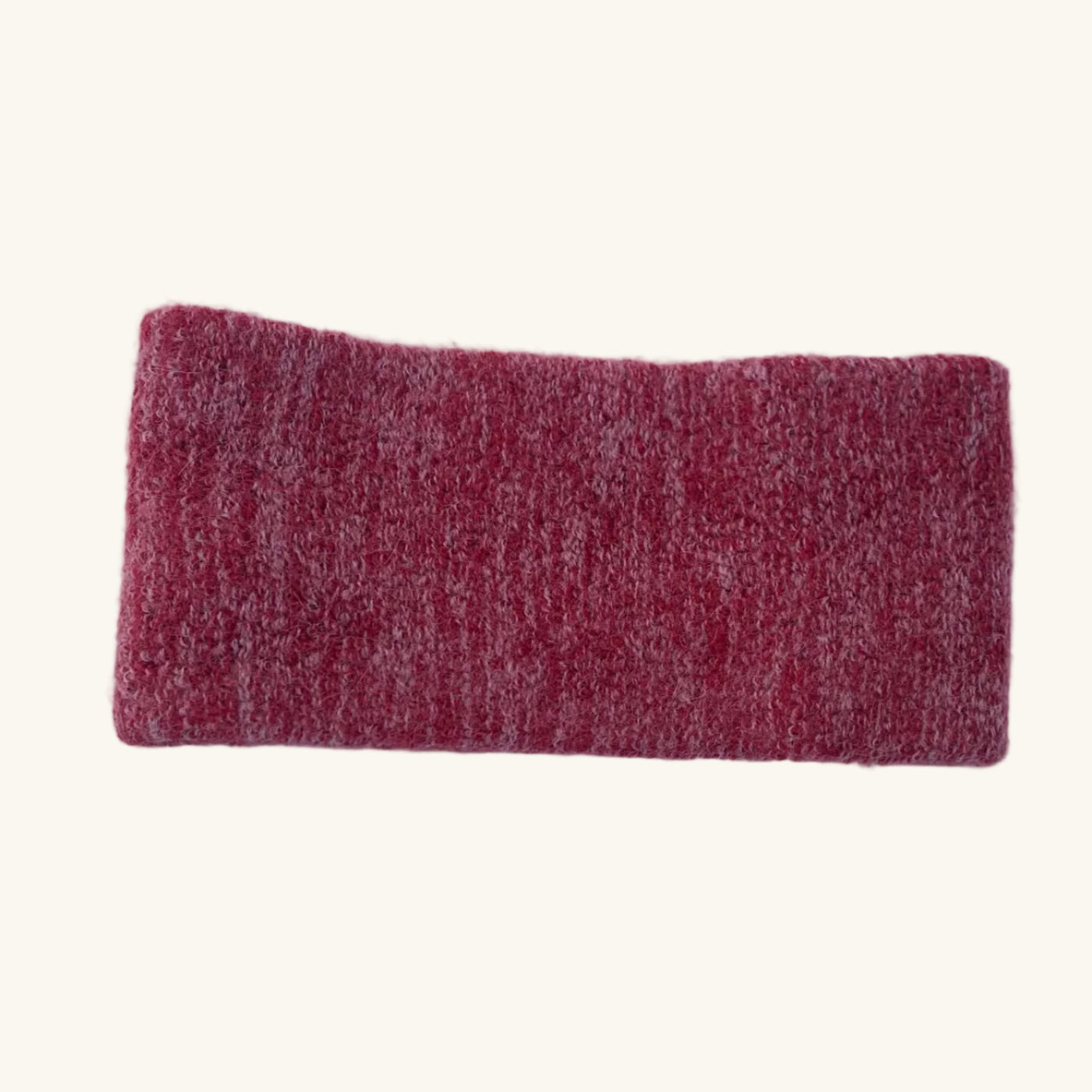 Red rectangular headband on a white surface