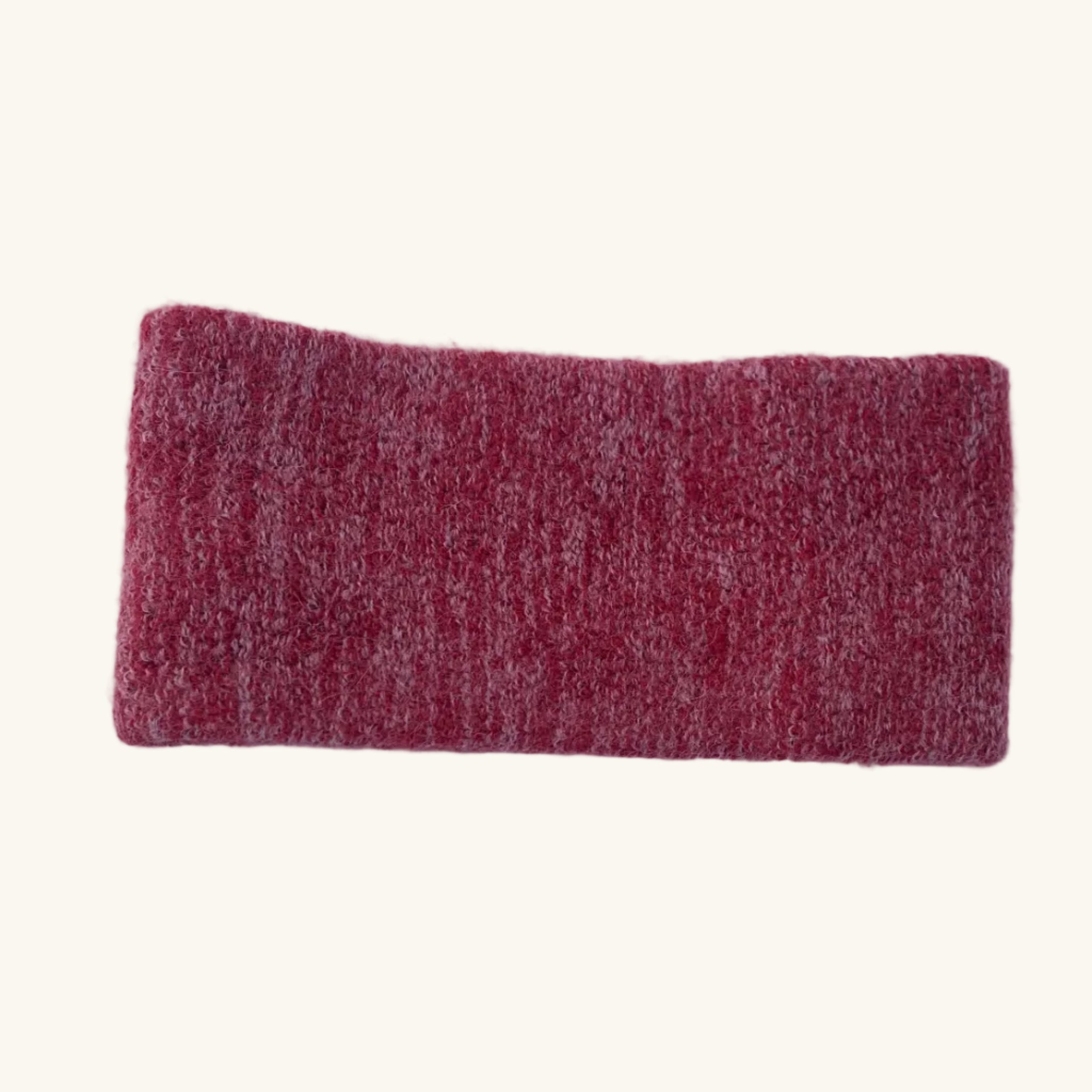 Red rectangular headband on a white surface